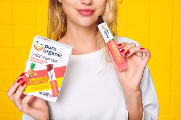 Lady eating a Pure Organic Snack
